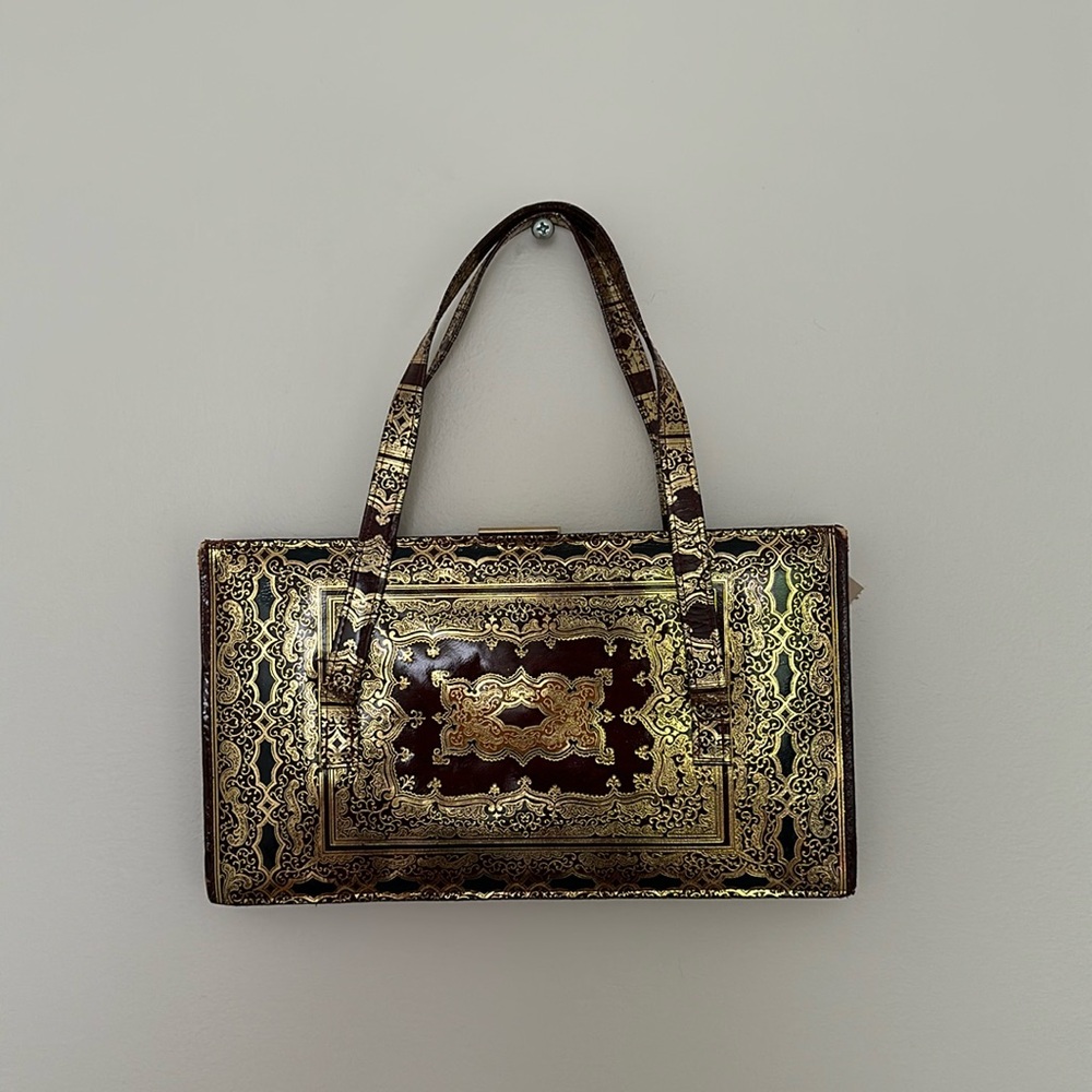 Dark burgundy and metallic gold women’s top handle handbag